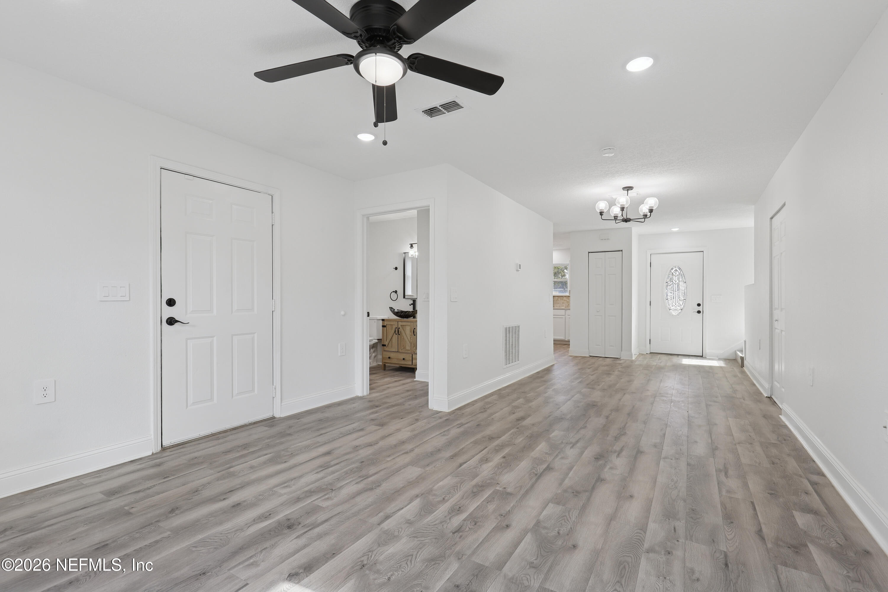 1022 Penman Road Jacksonville Beach, FL 32250 - Photo 27 of 52 a view of an empty room and wooden floor