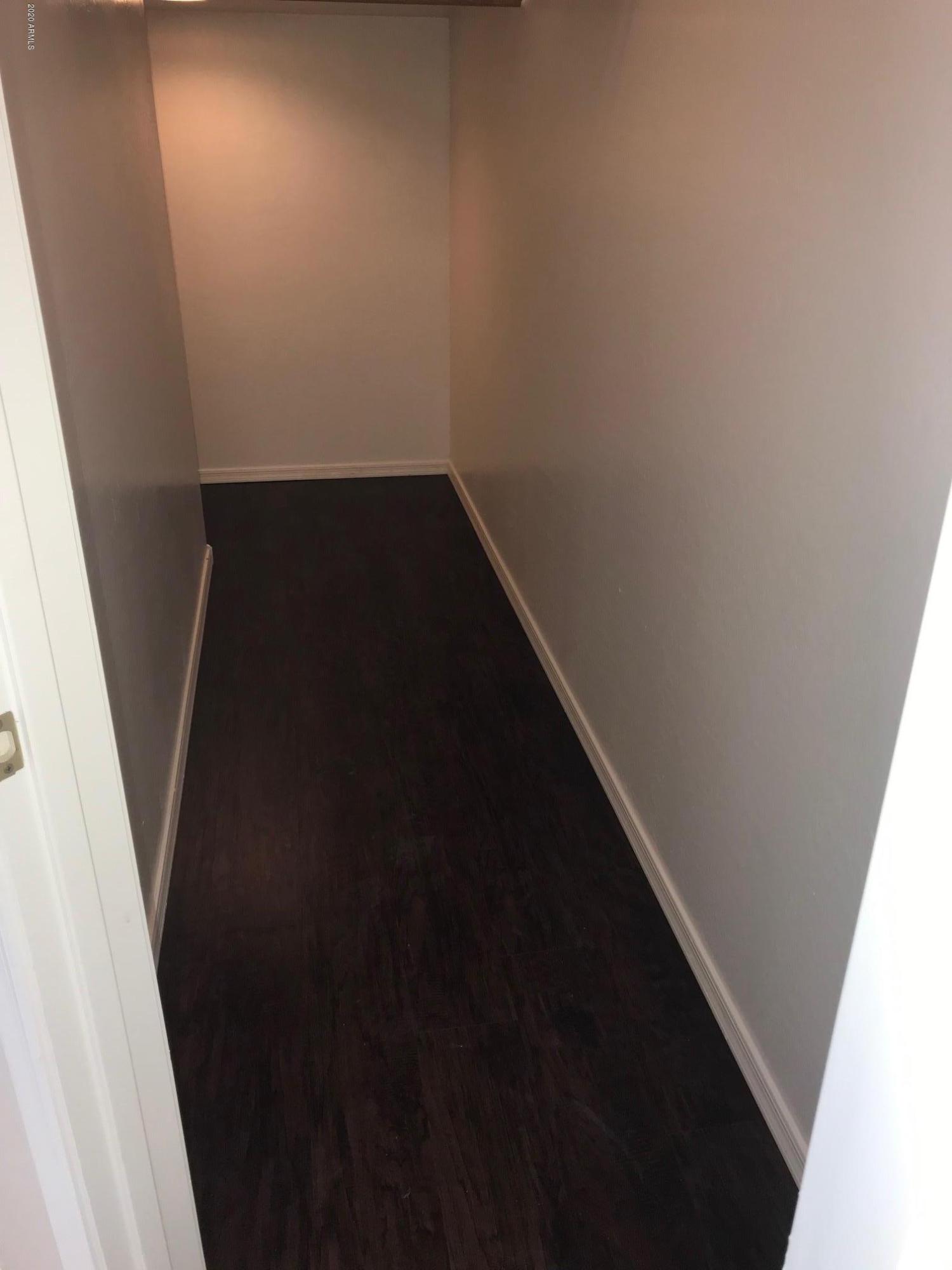 2523 West Granite Pass Road Phoenix, AZ 85085 - Photo 11 of 34 Under stairs wood flooring