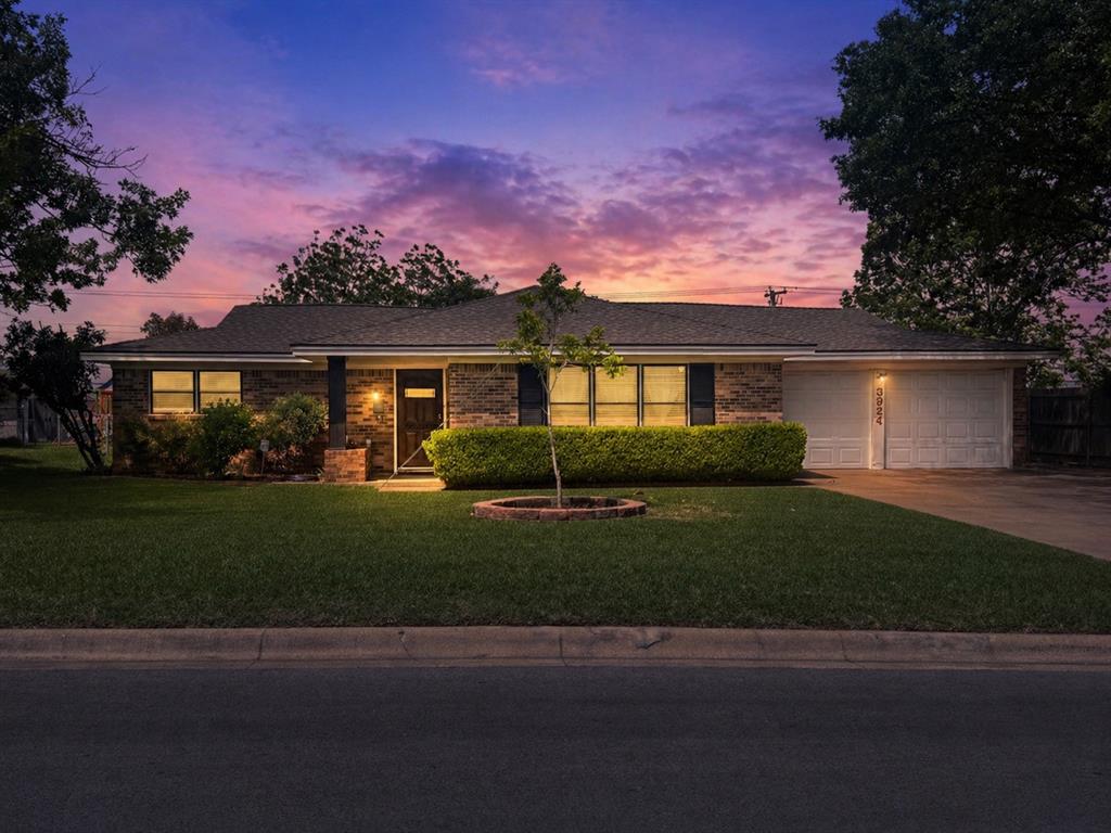 3924 Westerly Road Benbrook, TX 76116 - Photo 1 of 1 a front view of a house with a garden