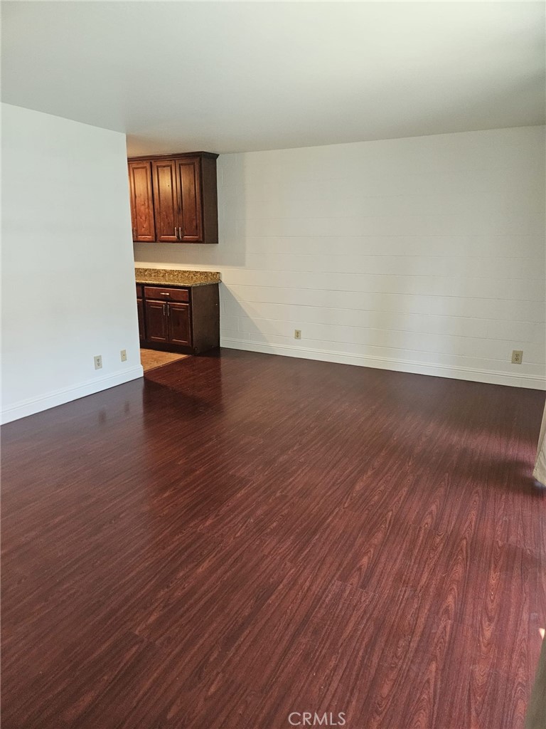 75 Western Shore Lane, Unit 1 San Francisco, CA 94115 - Photo 12 of 17 a view of an empty room and window with wooden floor