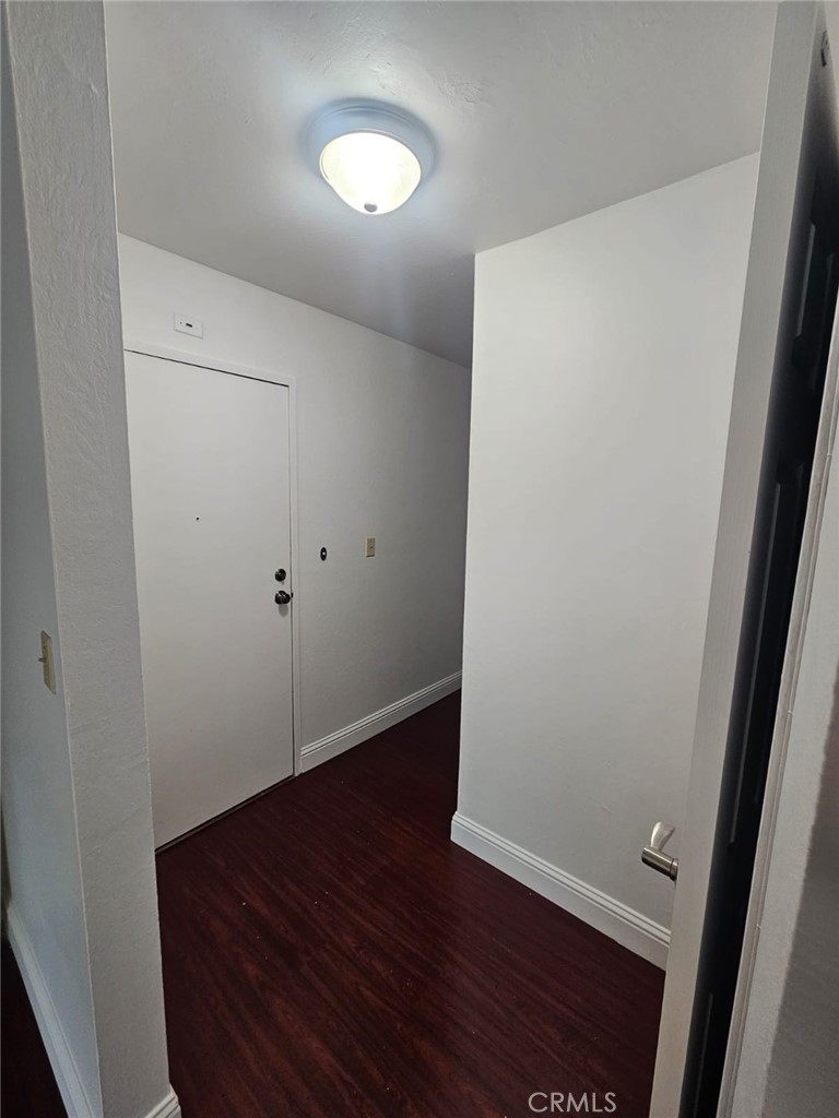 75 Western Shore Lane, Unit 1 San Francisco, CA 94115 - Photo 14 of 17 an empty room with wooden floor and entrance