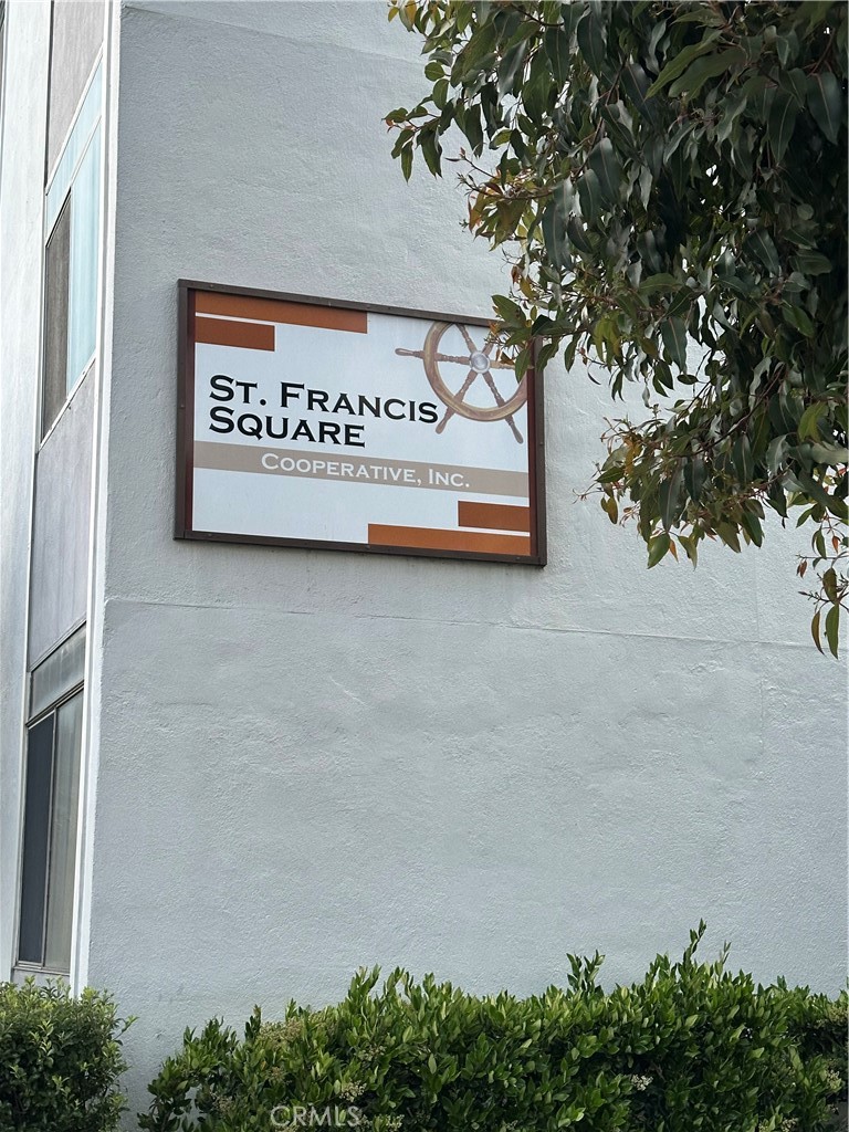 75 Western Shore Lane, Unit 1 San Francisco, CA 94115 - Photo 3 of 17 a sign on a wall next to a road