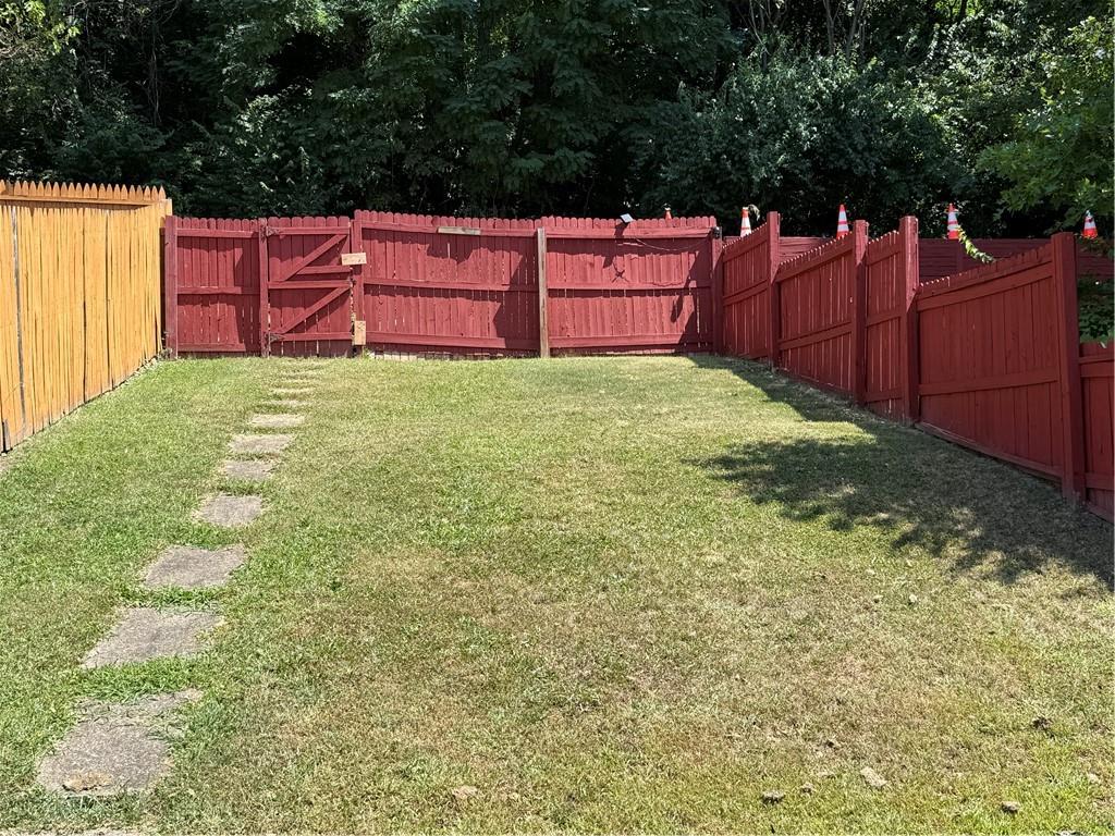 114 Greydon Avenue McKees Rocks, PA 15136 - Photo 12 of 12 a view of a backyard with wooden fence