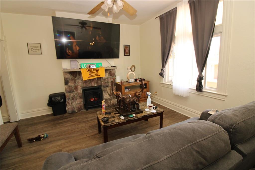 114 Greydon Avenue McKees Rocks, PA 15136 - Photo 5 of 12 a living room with furniture and a flat screen tv