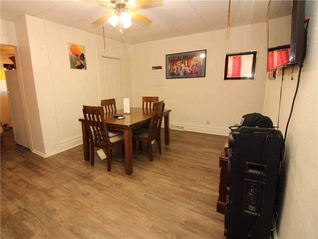 114 Greydon Avenue McKees Rocks, PA 15136 - Photo 7 of 12 a view of a dining room with furniture and chandelier