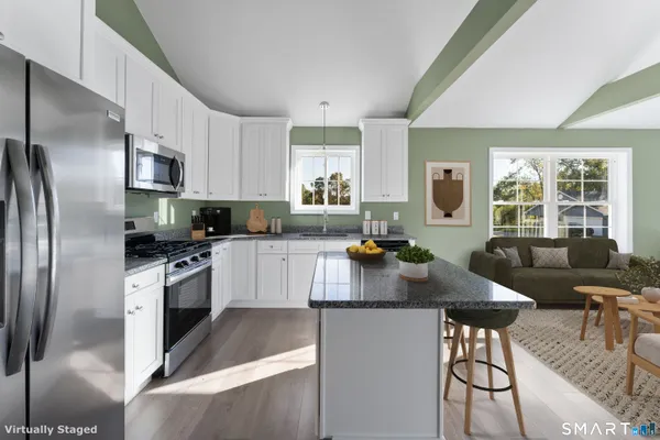 a living room with furniture and a large window