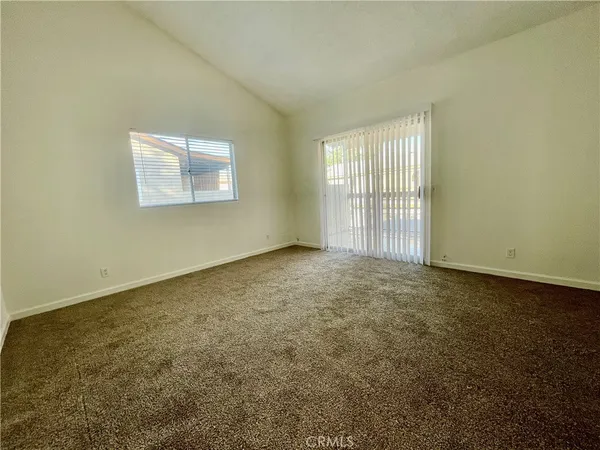 an empty room with a empty space and window