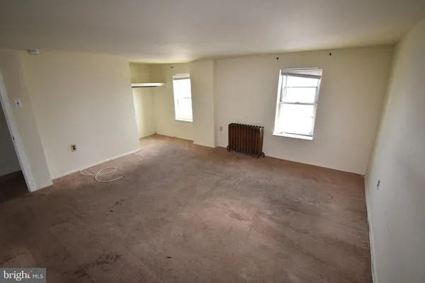 an empty room with windows