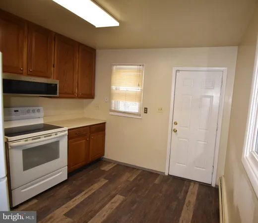 a bathroom with a sink and bathtub with toilet
