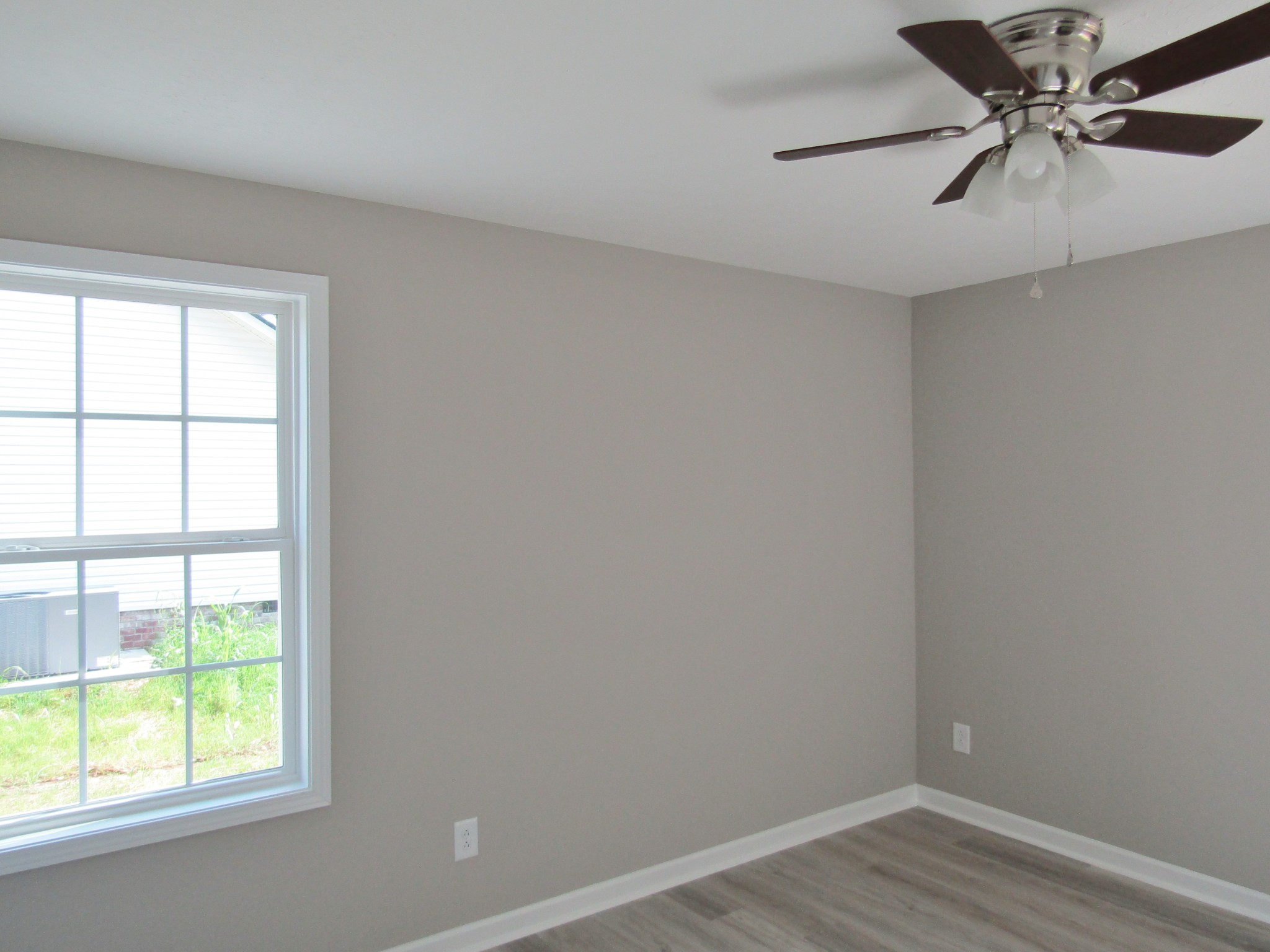 306 Ostella Road Cornersville, TN 37047 - Photo 13 of 15 an empty room with a window and a fan