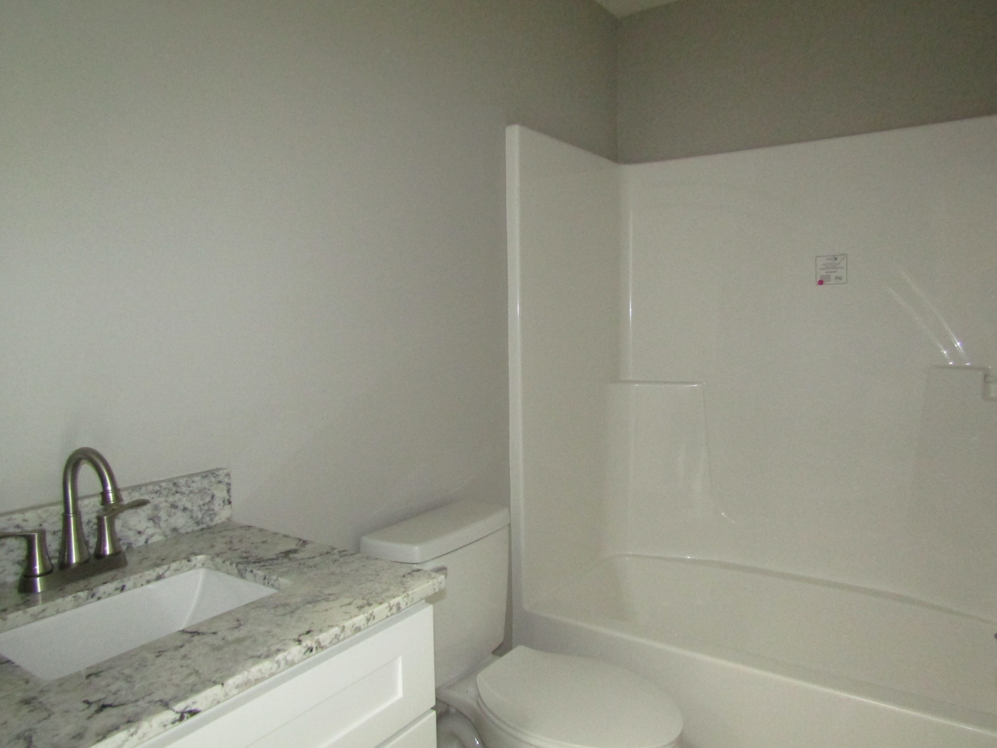 306 Ostella Road Cornersville, TN 37047 - Photo 15 of 15 a bathroom with a granite countertop sink toilet and shower