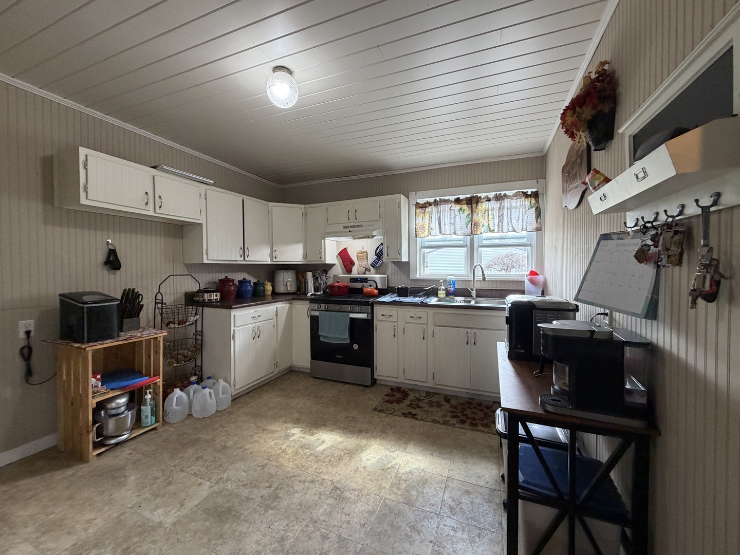 405 East Seminary Avenue Hoopeston, IL 60942 - Photo 13 of 38 a kitchen with sink cabinets and window