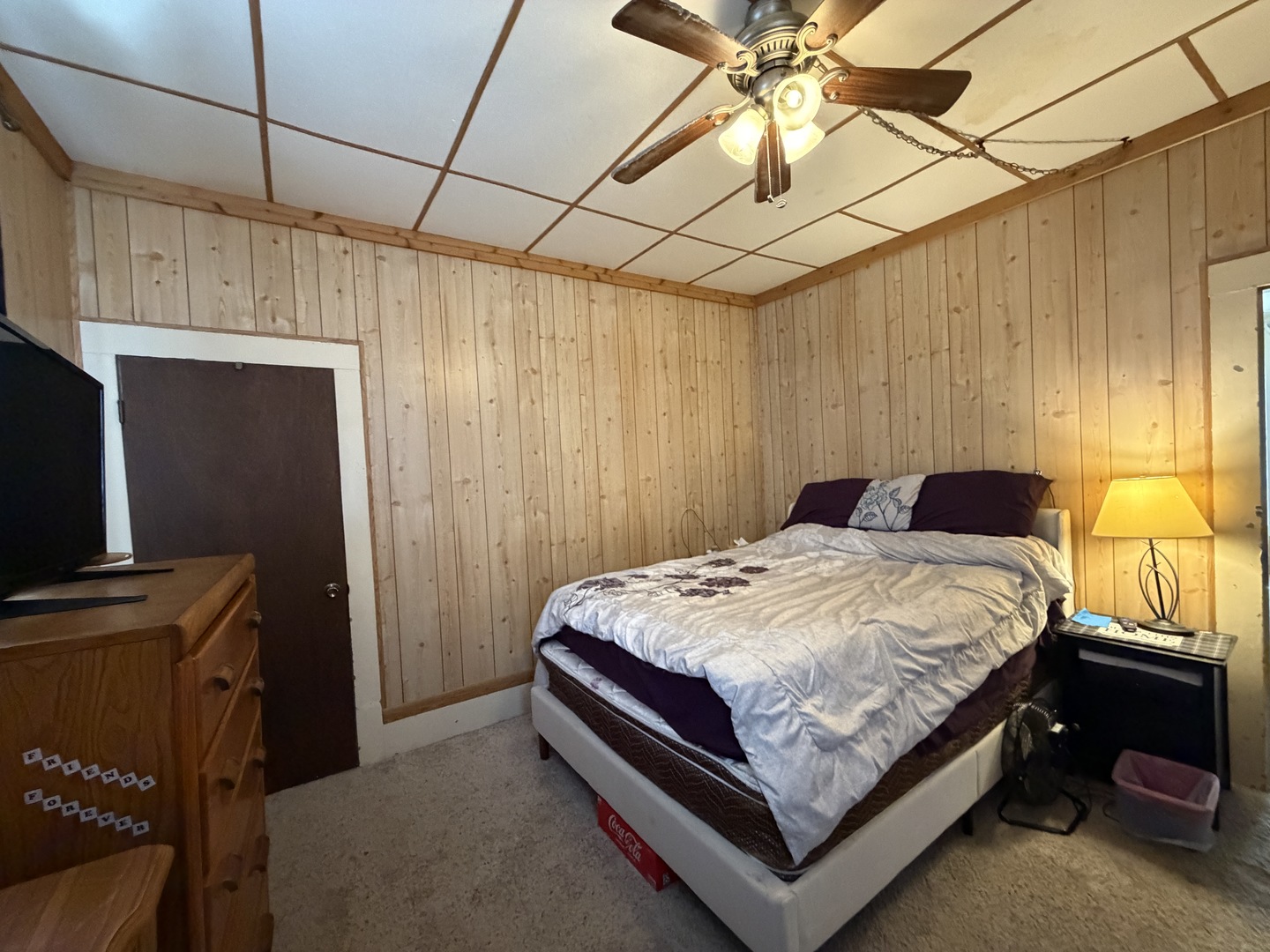 405 East Seminary Avenue Hoopeston, IL 60942 - Photo 19 of 38 a bedroom with a bed and a chandelier