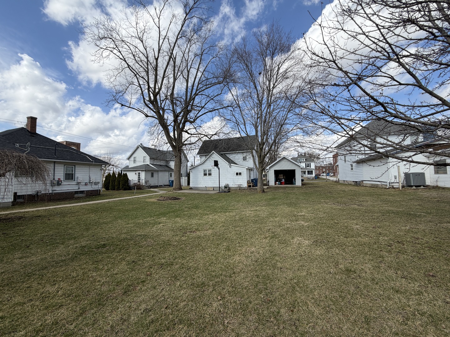 405 East Seminary Avenue Hoopeston, IL 60942 - Photo 31 of 38 a view of a trees in front of a house with a yard