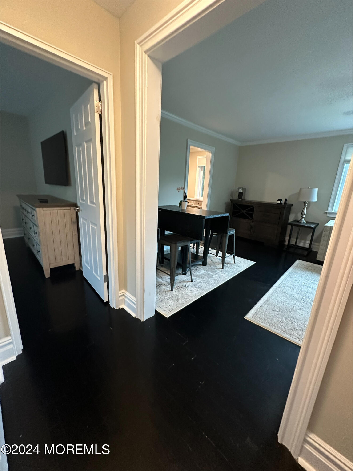 283 Spring Street, Unit 3D Red Bank, NJ 07701 - Photo 11 of 18 a dining room with furniture and wooden floor