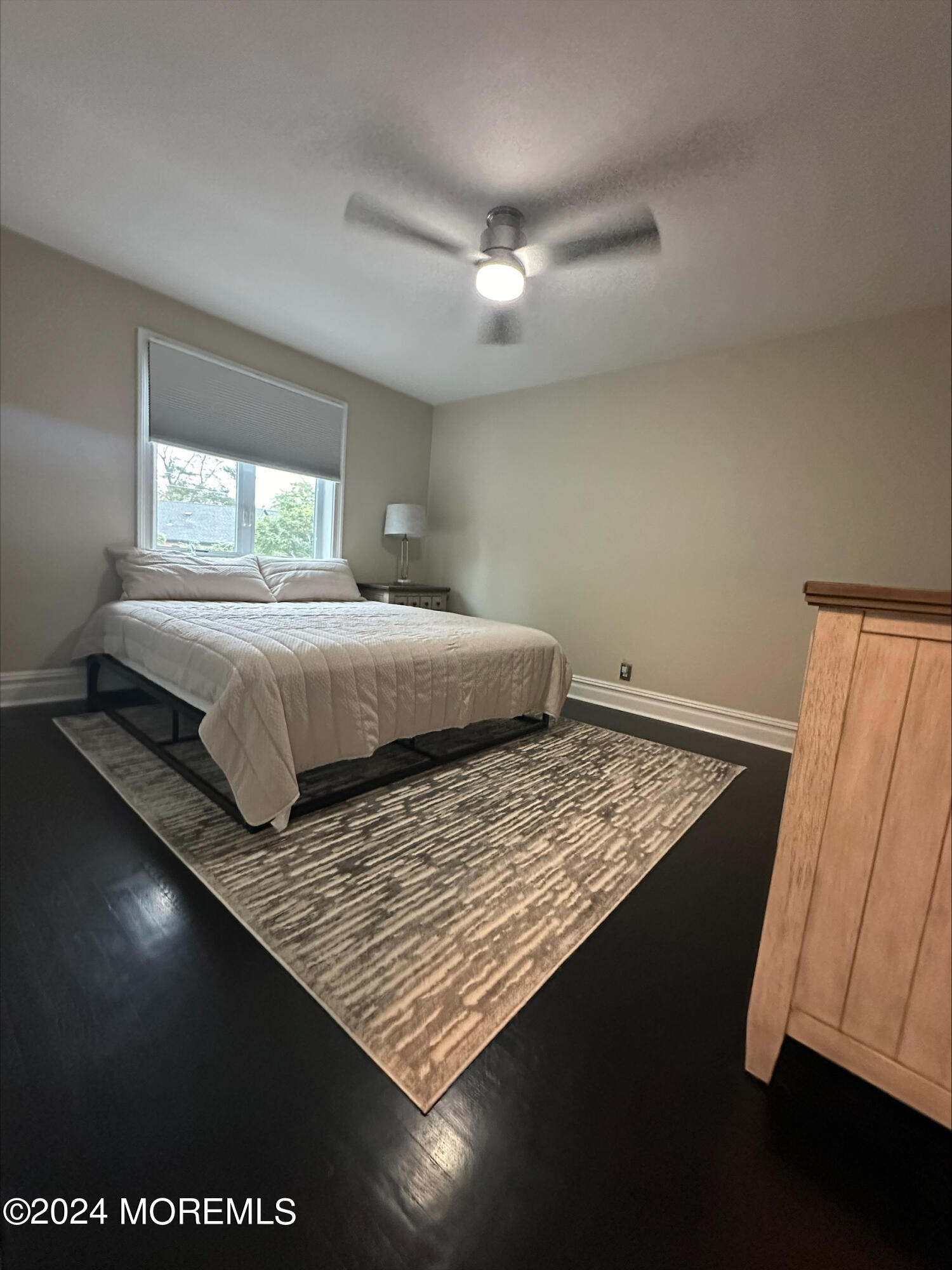 283 Spring Street, Unit 3D Red Bank, NJ 07701 - Photo 16 of 18 a bedroom with a bed and window