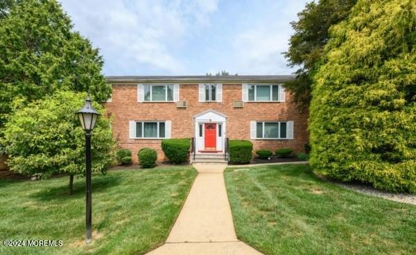 283 Spring Street, Unit 3D Red Bank, NJ 07701 - Photo 18 of 18 a front view of house with yard and green space