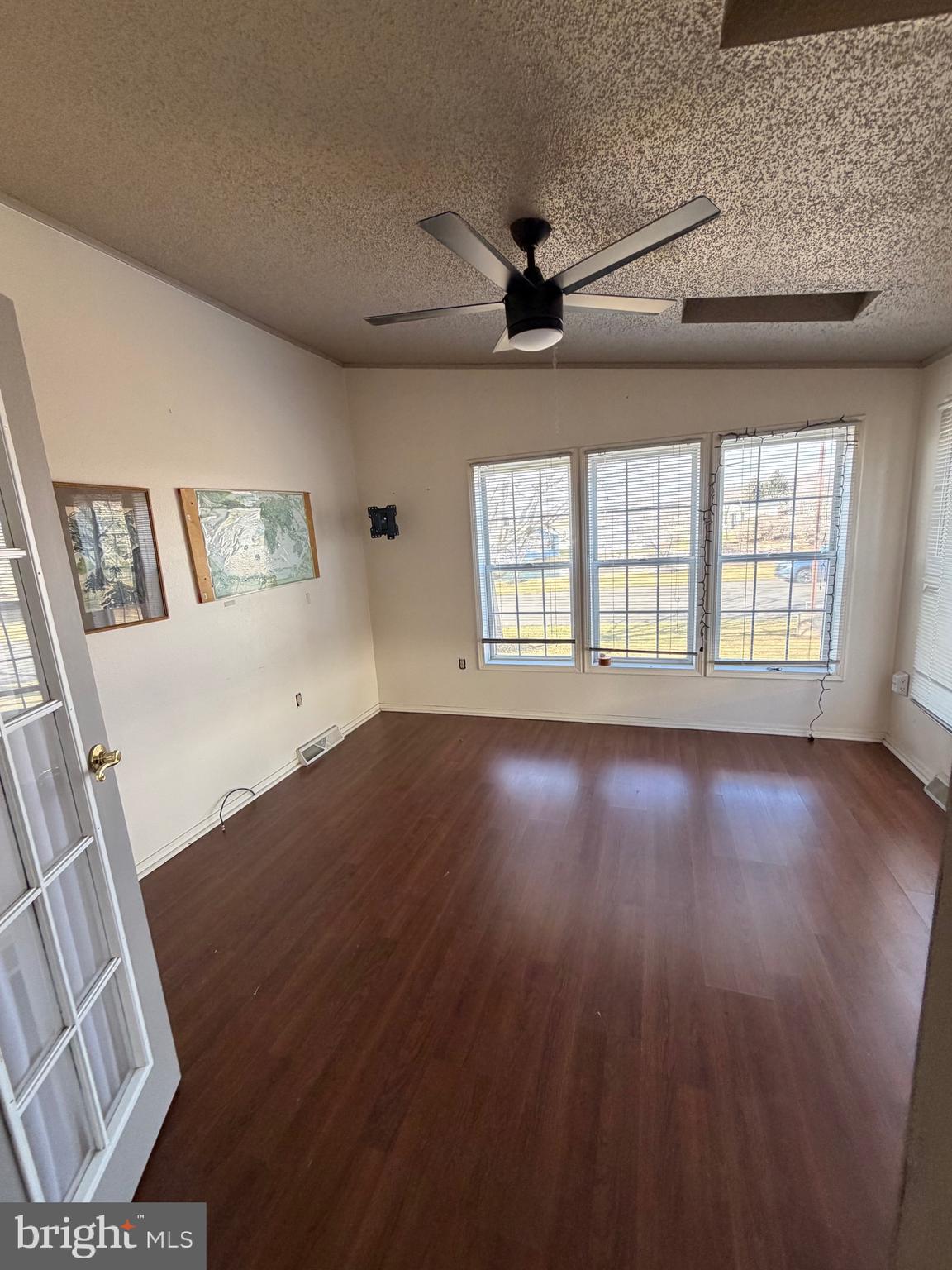 3 Juniper Circle New Hope, PA 18938 - Photo 7 of 18 a view of an empty room with wooden floor and a window