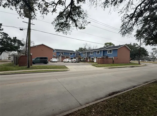 a city view with houses on the road