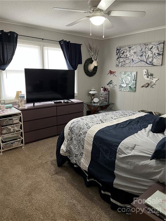 2419 Winfield Street Kannapolis, NC 28083 - Photo 14 of 25 a bedroom with a bed and a flat screen tv