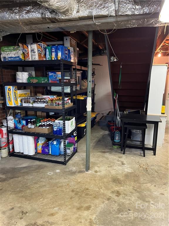 2419 Winfield Street Kannapolis, NC 28083 - Photo 20 of 25 a room with lots of furniture and a book shelf