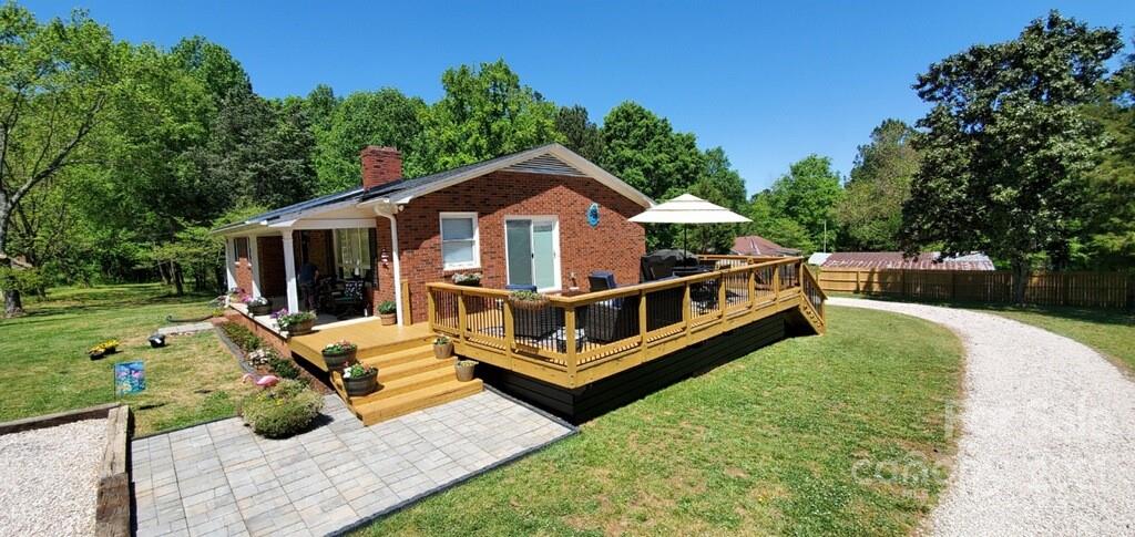 2419 Winfield Street Kannapolis, NC 28083 - Photo 2 of 25 a view of a house with backyard sitting area and garden