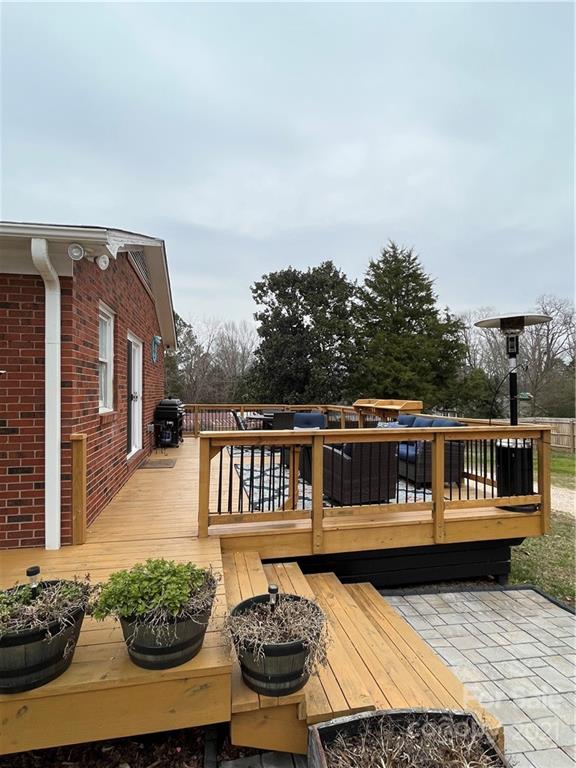 2419 Winfield Street Kannapolis, NC 28083 - Photo 22 of 25 a balcony with wooden floor table and chairs