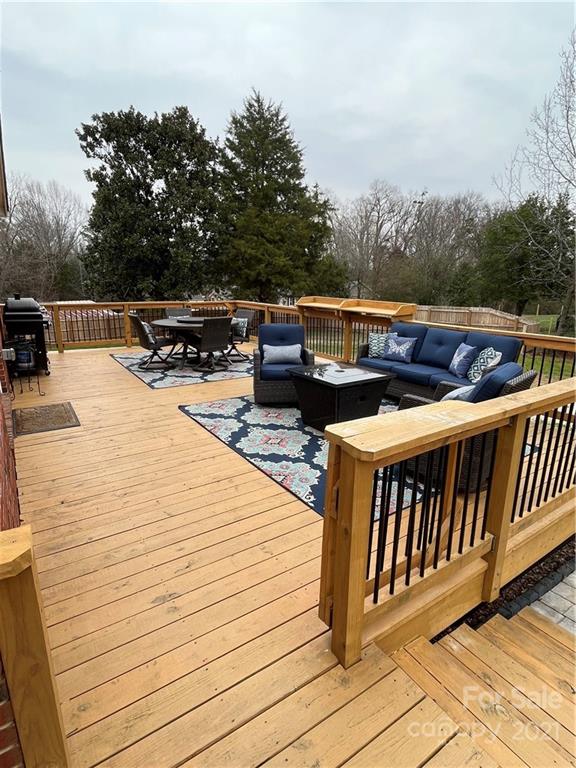2419 Winfield Street Kannapolis, NC 28083 - Photo 23 of 25 a balcony with wooden floor and fence