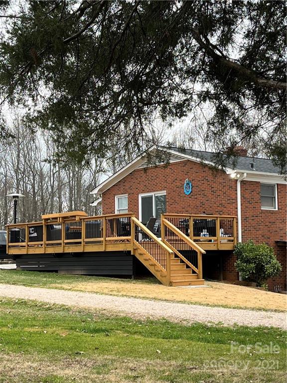 2419 Winfield Street Kannapolis, NC 28083 - Photo 24 of 25 a view of a house with swimming pool next to a large tree