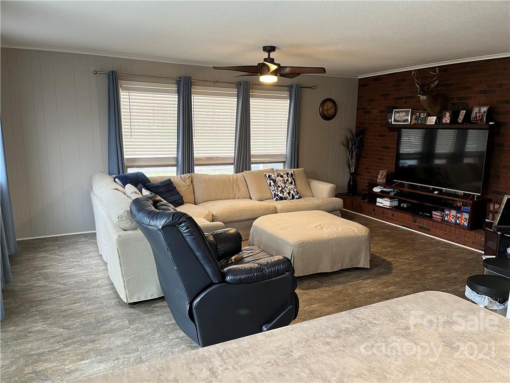 2419 Winfield Street Kannapolis, NC 28083 - Photo 5 of 25 a living room with furniture and a flat screen tv
