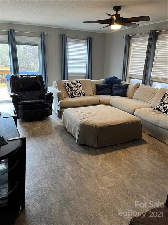 2419 Winfield Street Kannapolis, NC 28083 - Photo 6 of 25 a spacious bedroom with a bed a couch and a dresser