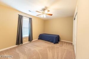 338 Pistole Road Sparta, TN 38583 - Photo 26 of 39 a bedroom with a bed and a chandelier
