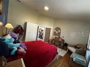 a bed room with a bed window and couch