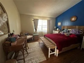 a bed room with a bed and furniture