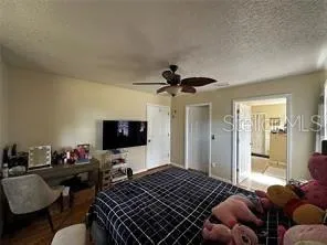 a bedroom with a bed and a couch