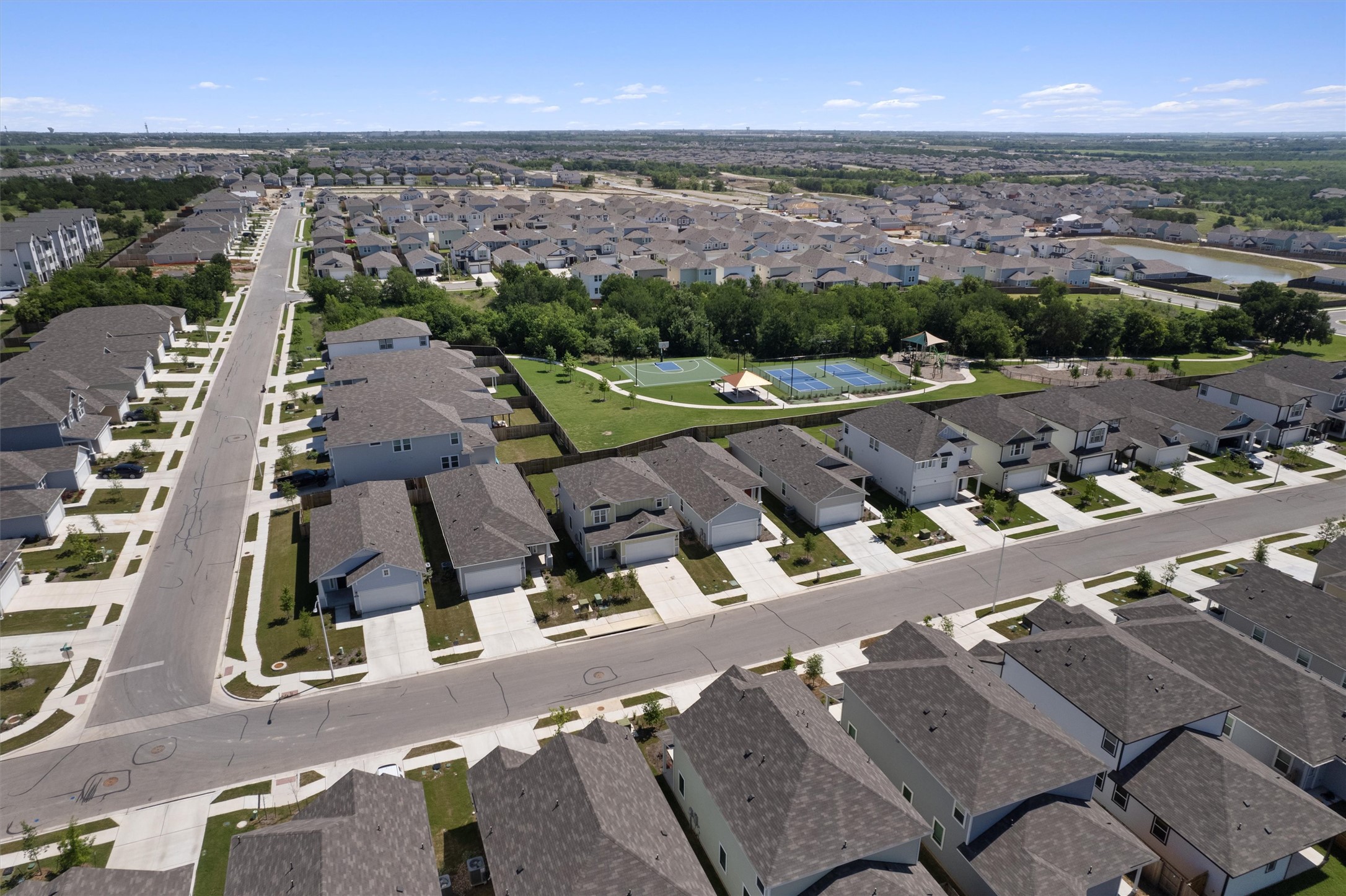 2606 Totley Road Manor, TX 78653 - Photo 3 of 28 an aerial view of a house with a garden