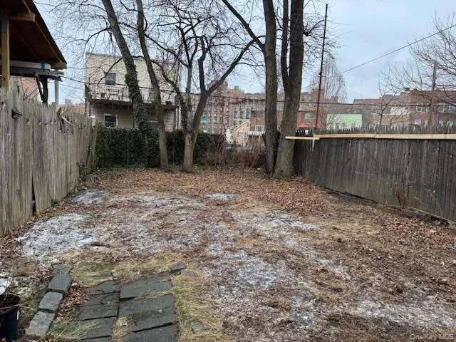 a view of a backyard of the house