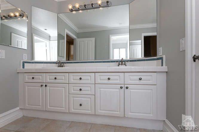 57 Highland Road Simi Valley, CA 93065 - Photo 19 of 46 a bathroom with white cabinets
