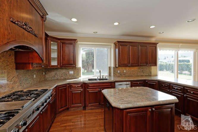 57 Highland Road Simi Valley, CA 93065 - Photo 3 of 46 a kitchen with a sink stove and cabinets