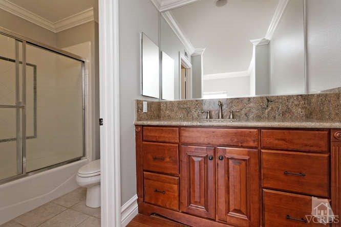 57 Highland Road Simi Valley, CA 93065 - Photo 22 of 46 a bathroom with a granite countertop sink a toilet and shower