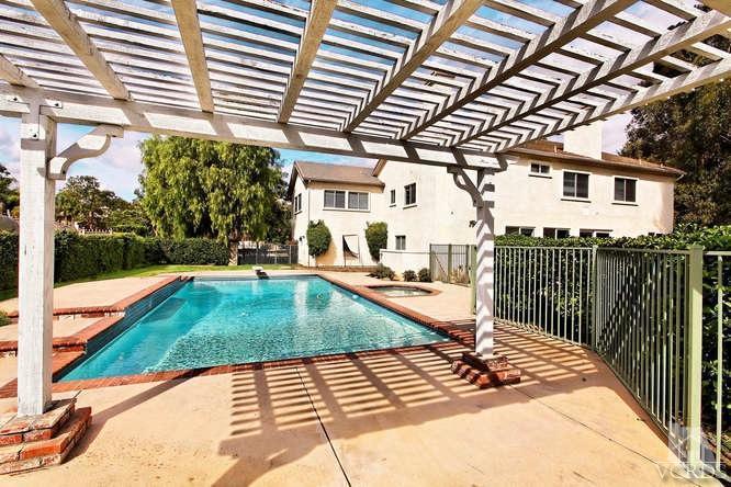 57 Highland Road Simi Valley, CA 93065 - Photo 24 of 46 a view of a patio with a table and chairs and wooden fence