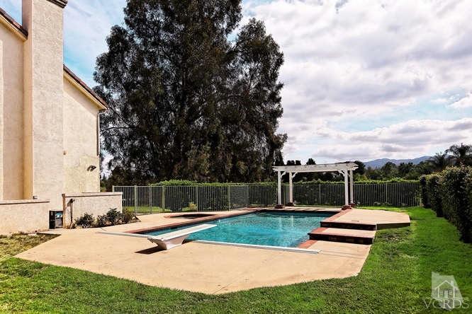 57 Highland Road Simi Valley, CA 93065 - Photo 27 of 46 a swimming pool with outdoor seating and garden