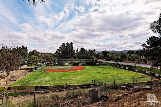 57 Highland Road Simi Valley, CA 93065 - Photo 4 of 46 a view of a swimming pool with lawn chairs under an umbrella