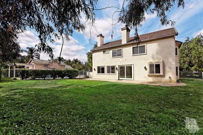 57 Highland Road Simi Valley, CA 93065 - Photo 44 of 46 a view of a white house with a big yard and large trees