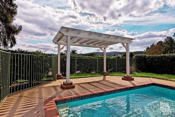 57 Highland Road Simi Valley, CA 93065 - Photo 45 of 46 a view of a patio with a table chairs and a backyard