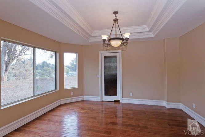 57 Highland Road Simi Valley, CA 93065 - Photo 9 of 46 a view of a livingroom with a chandelier and wooden floor