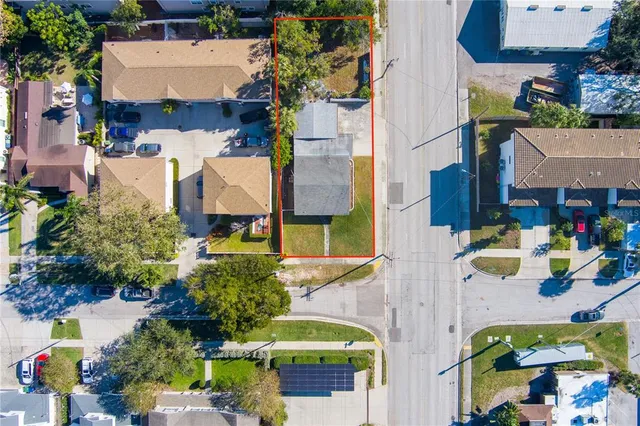 an aerial view of residential houses with outdoor space