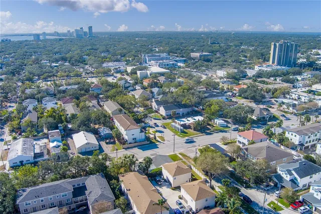 an aerial view of residential houses with outdoor space