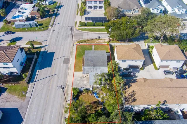 an aerial view of a house with a swimming pool