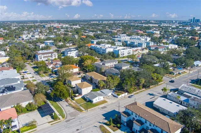 an aerial view of residential houses with outdoor space